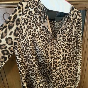 Women’s White House Black Market leopard print blouse in new condition.